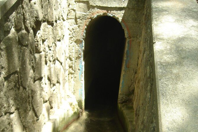 Guided Bus Trip to Lindos village & 7 Springs - Stop One: Epta Piges Seven Springs and the 186 m tunnel to the lake