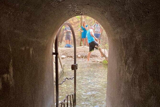 Guided hike to the seven springs from Archangelos - The tunnel crossing: where wet feet become part of the adventure