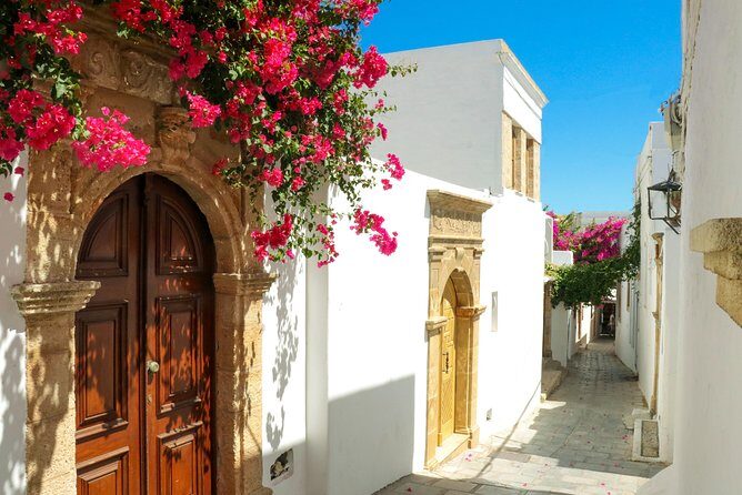 Lindos Day Cruise from Rhodes Town with Swimming stops and Hotel Transfers - Lindos Beach and leisure time: where the postcard moment happens