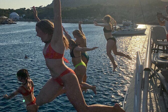 Rhodes Bay to Bay Swim Cruise-Greek Buffet w/wine included - Afandou Beach and Lunch Back On Board: Pebbles, Caves, and Invisible Town