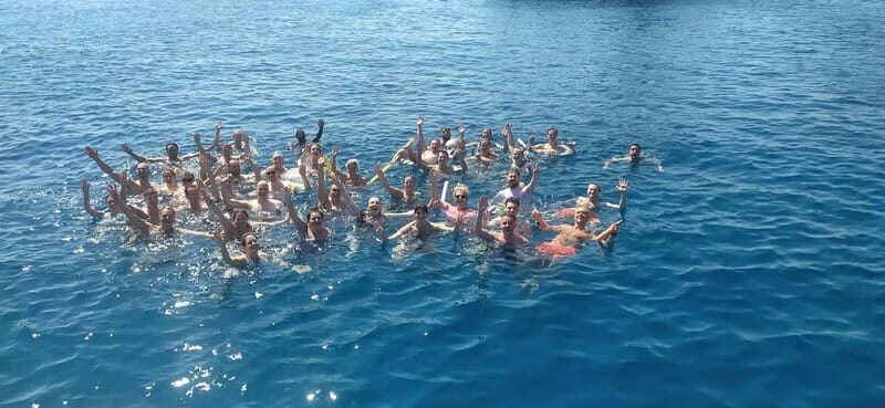 Rhodes: Pleasure Cruise for Swimming and Snorkeling - Onboard Reality: Shade, Music, Gear, and a Bar for Extra Costs