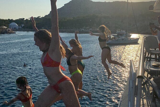 Rhodes Sunset Cruise - Swim and Dine w/ Live Music & Sunset! - Mandraki Port to Old Town walls: the best kind of sightseeing