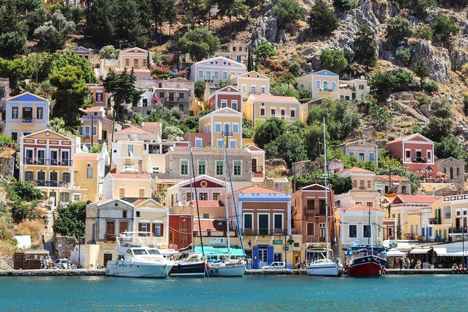 Symi Island from Rhodes with transfers from Ialysos and Ixia - St. George’s Bay: photos on the cliff and a summer swim option